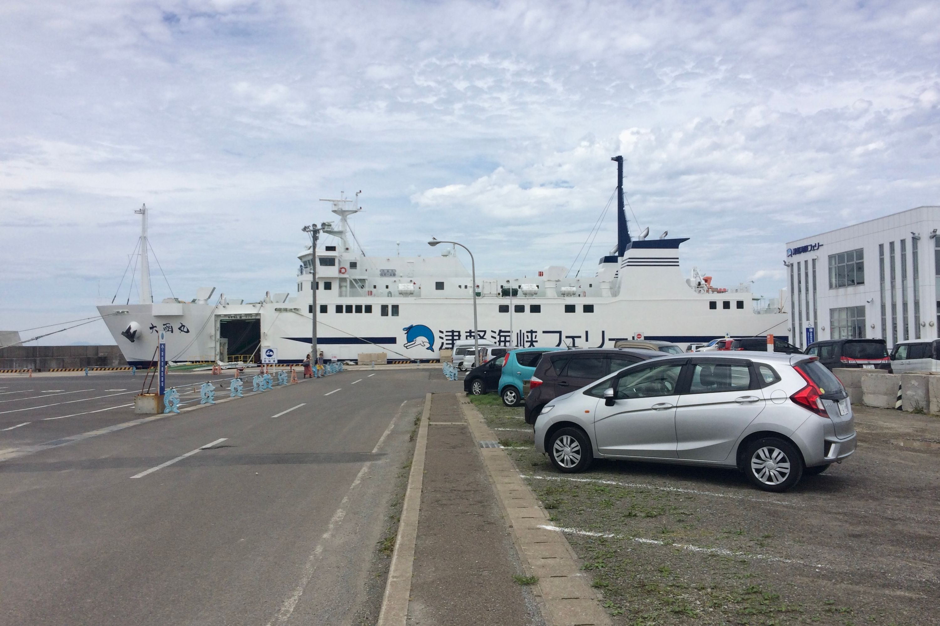 A large ship called Daikan Maru anchored in a harbor.