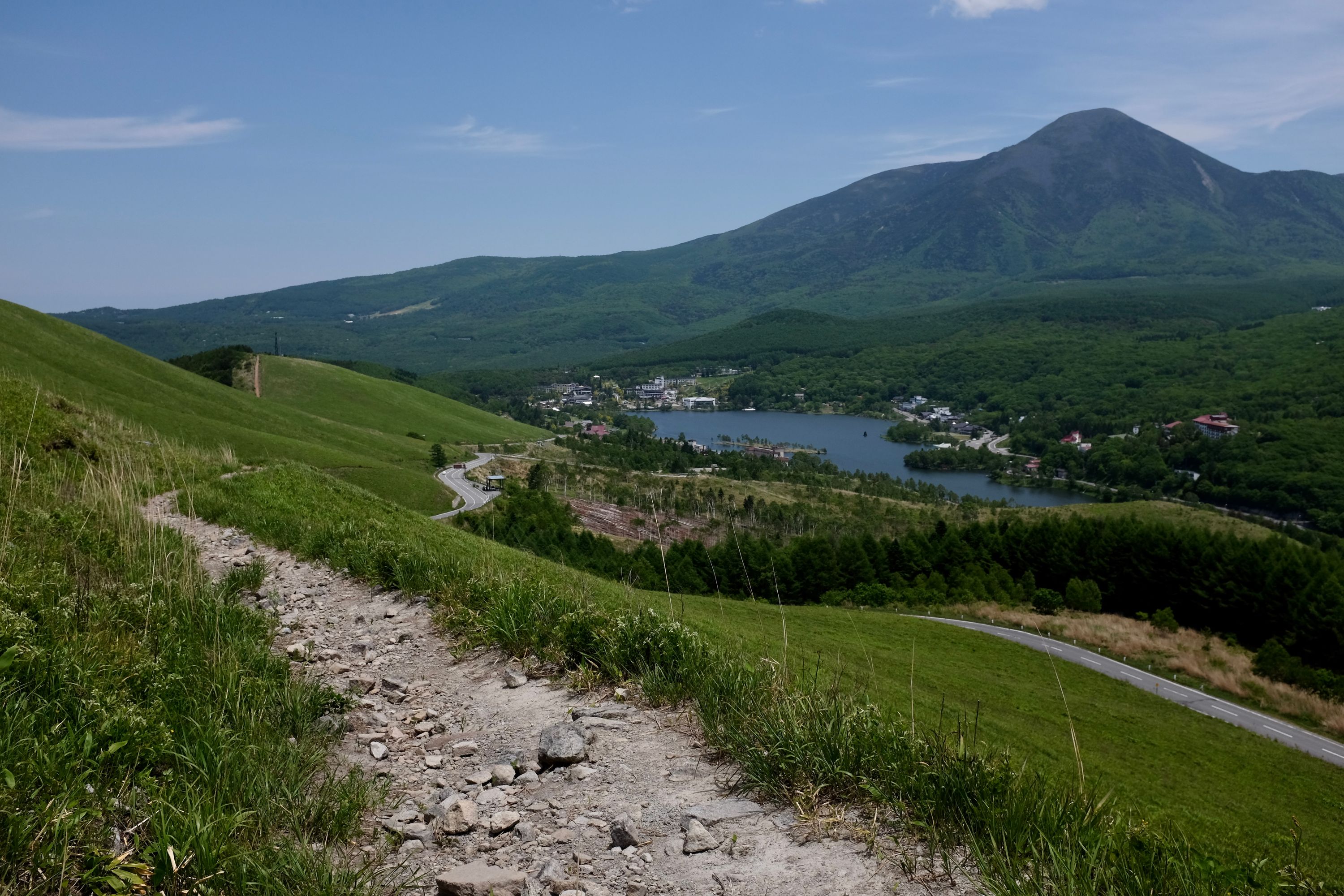 A view of Lake Shirakaba and Mount Tateshina from a mountain trail.