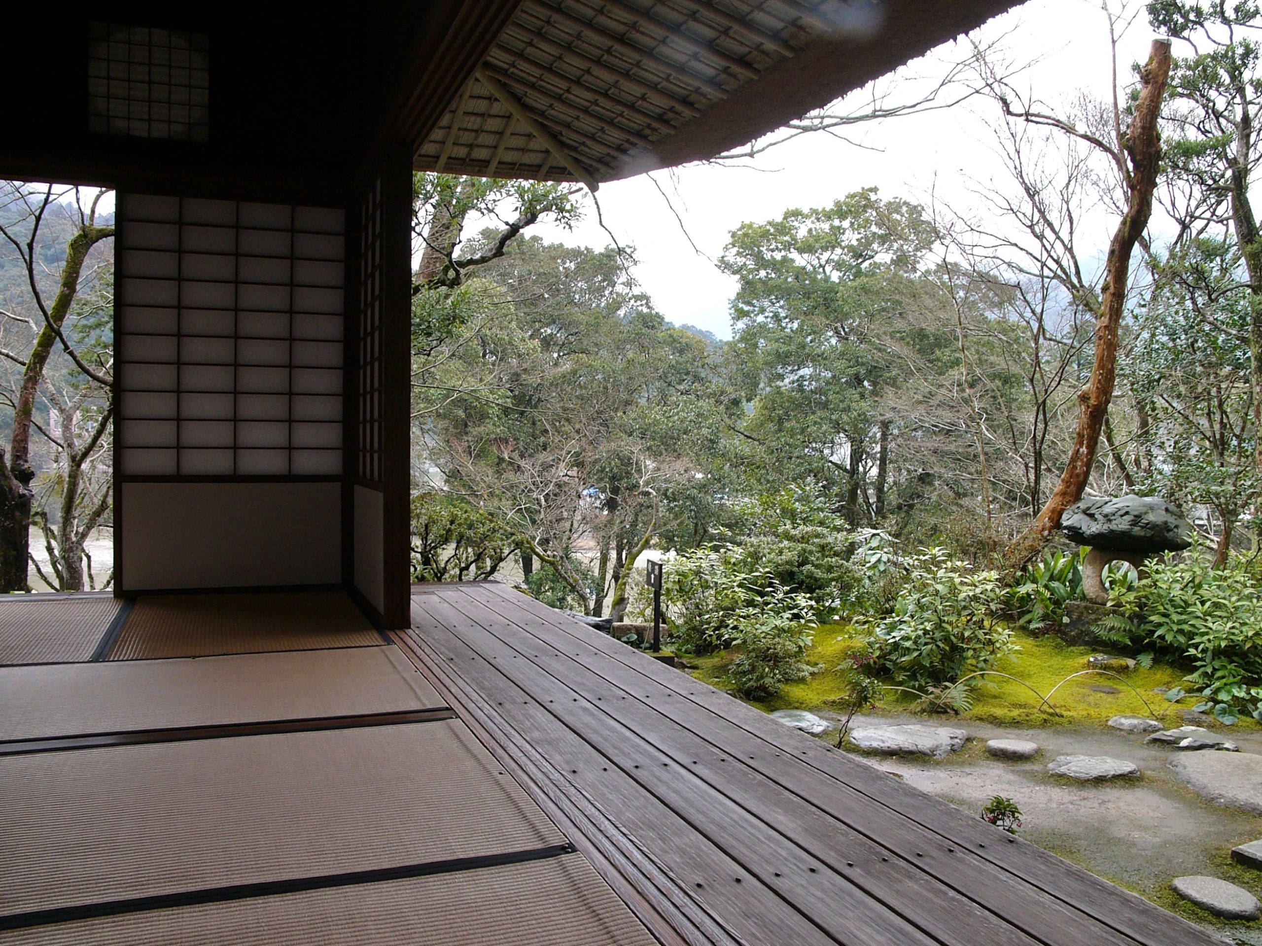 Looking out on an elaborately landscaped garden from the porch of the same house.