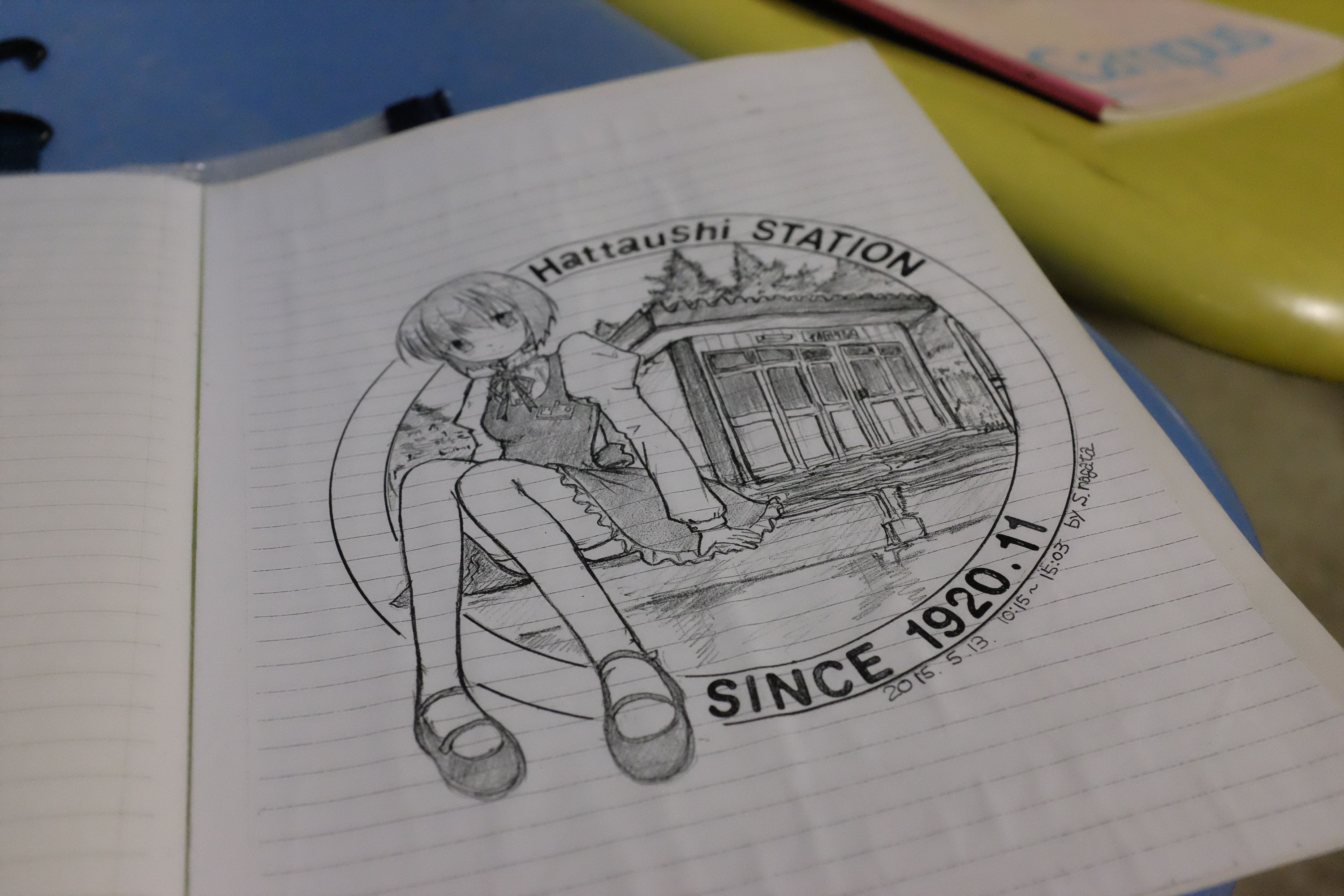 A drawing in the guest book of Hattaushi Station shows a young girl in manga style sitting in front of the station building.
