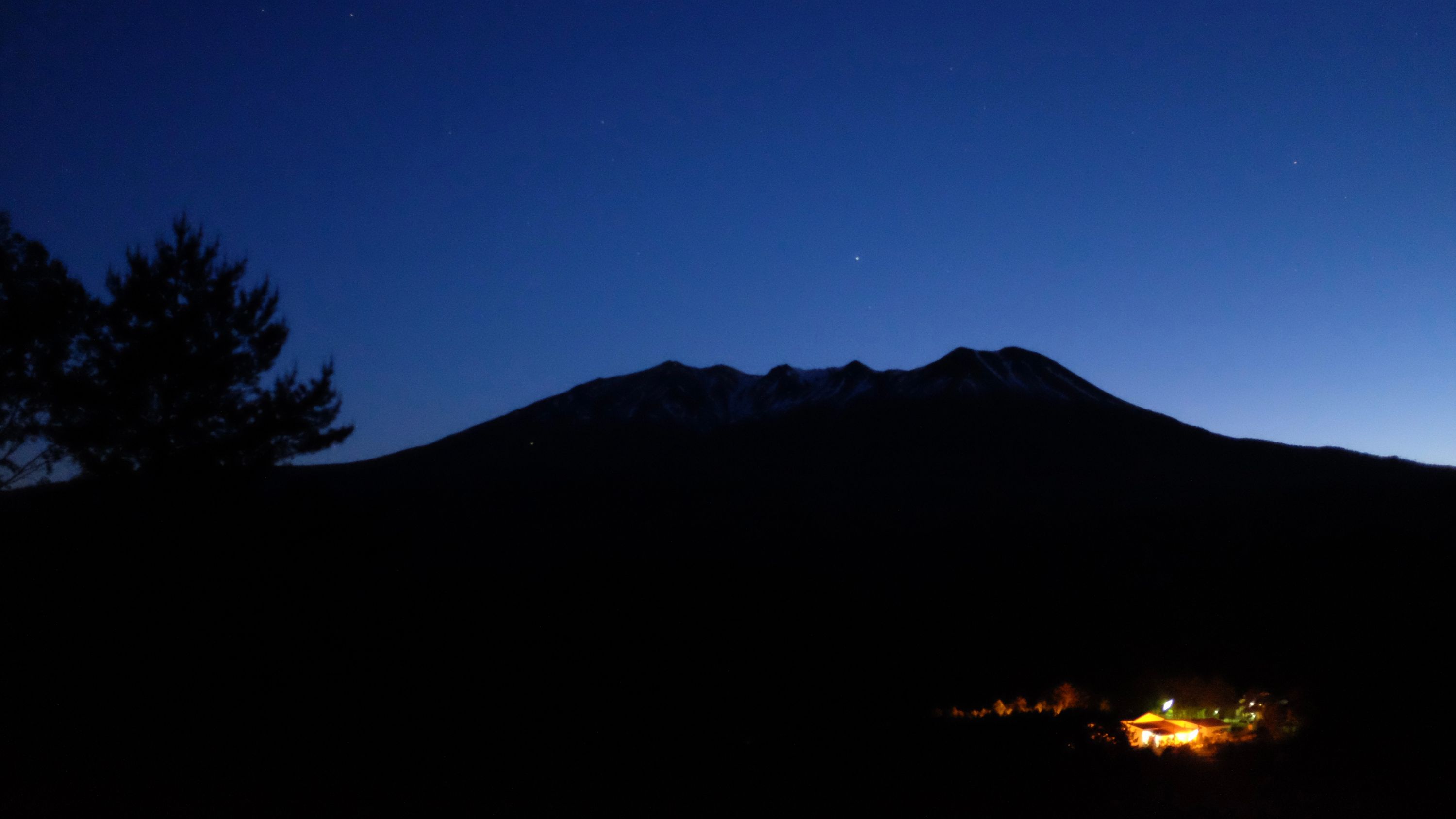 The silhouette of Mount Ontake in the evening sky.