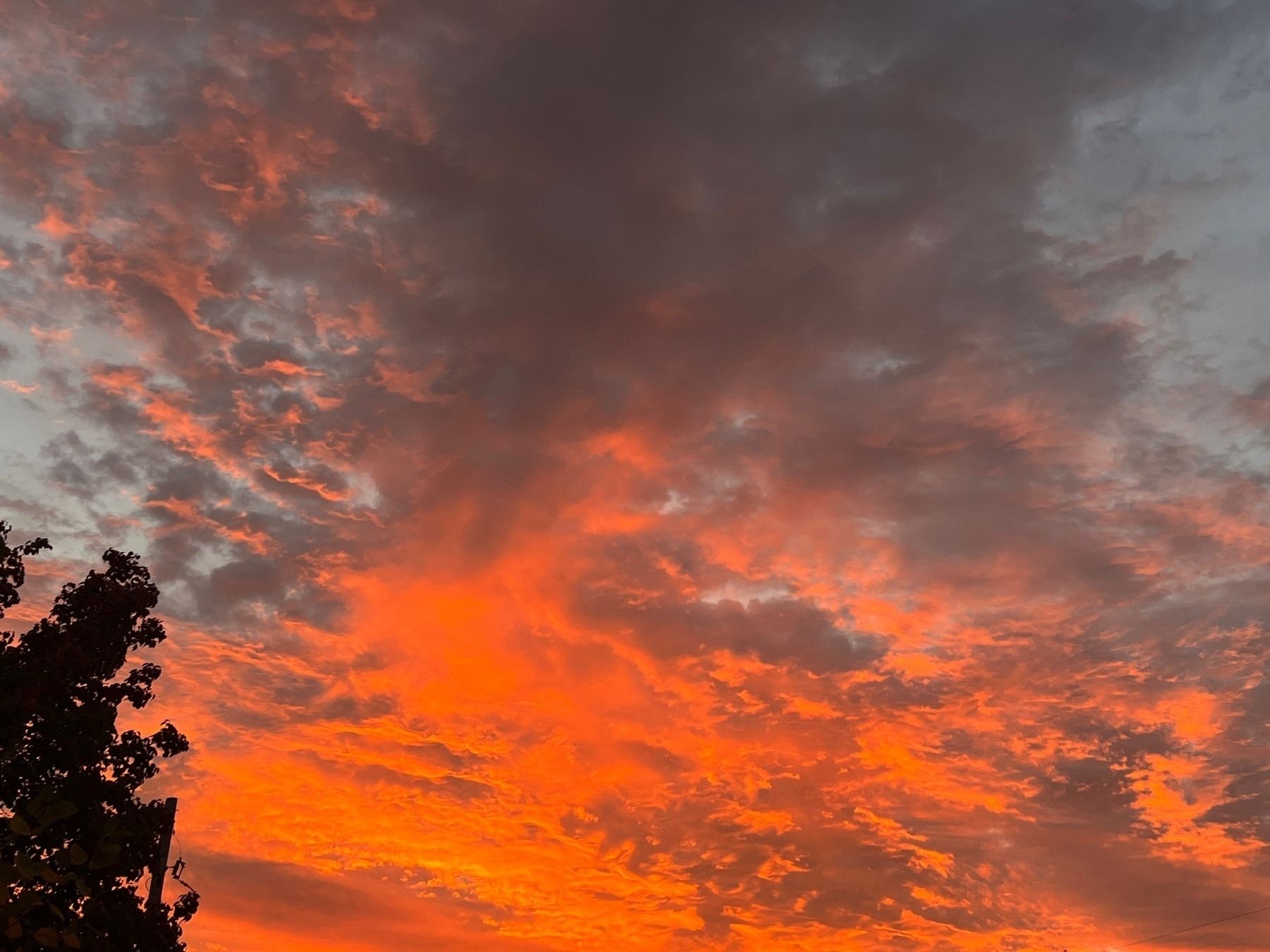 Sunrise morning sky with orange pink and blue gray clouds